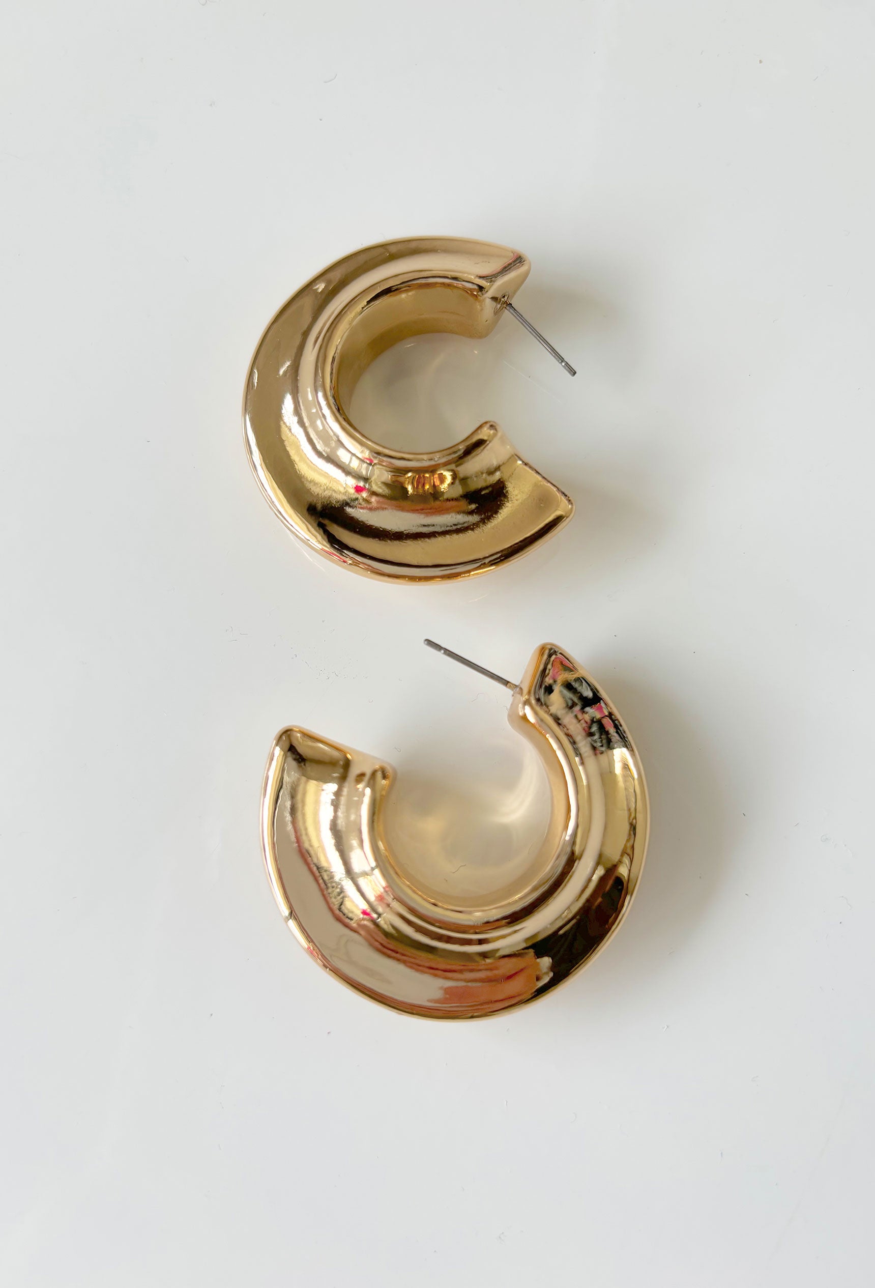 Hoop earrings with primal allure