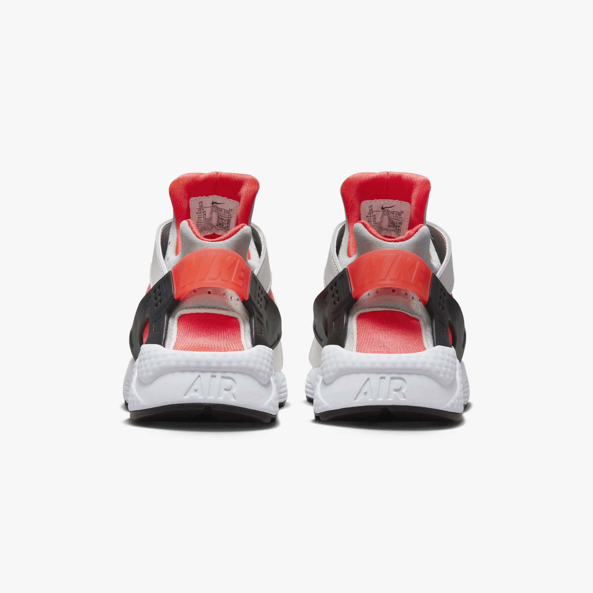 Nike Air Huarache sneakers in white, metallic silver, infrared 23, and black.