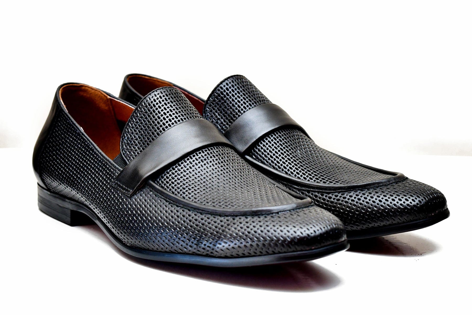 Valkan black perforated leather loafers for sale.