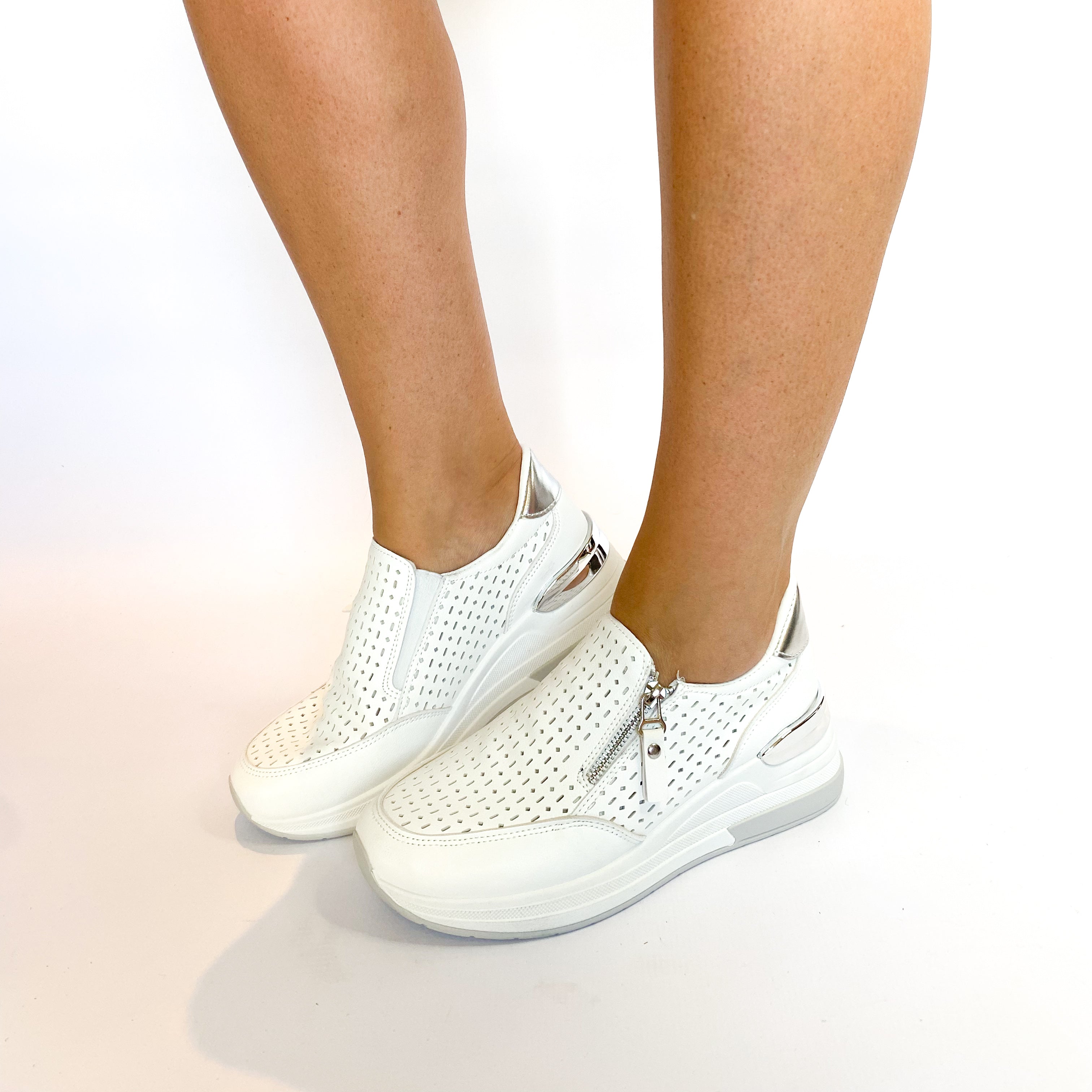 White platform zip slip-on shoes.